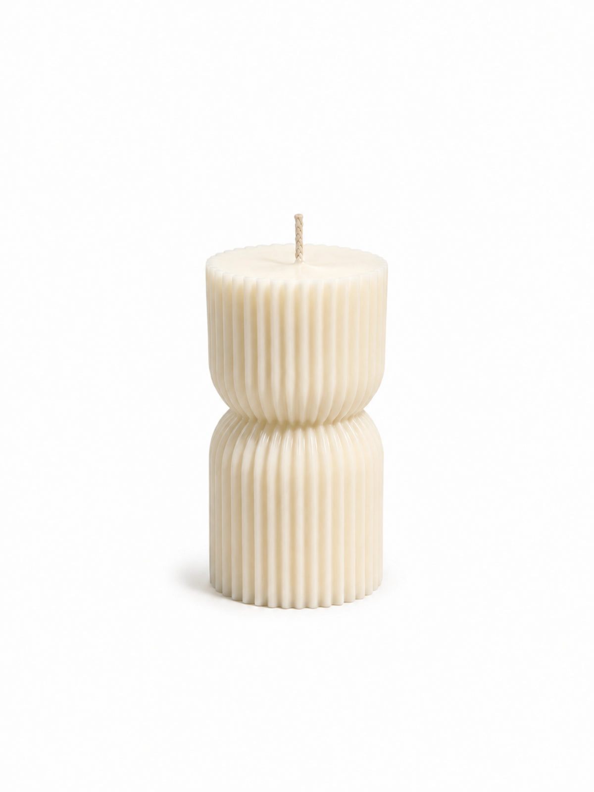 An off-white ribbed pillar candle with a wick at the top, standing upright against a clean white background.